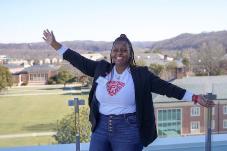 Happy alumna on campus