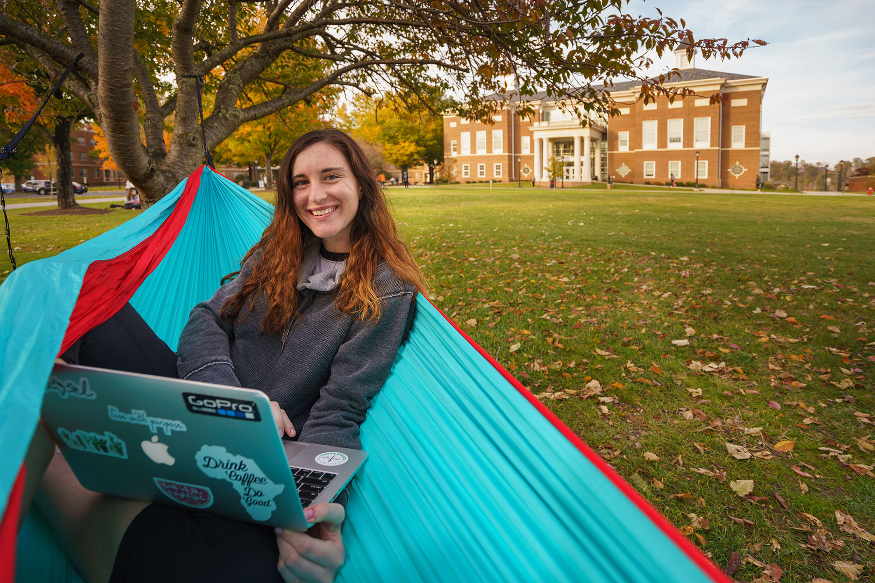 Student in front of Hemphill Hall