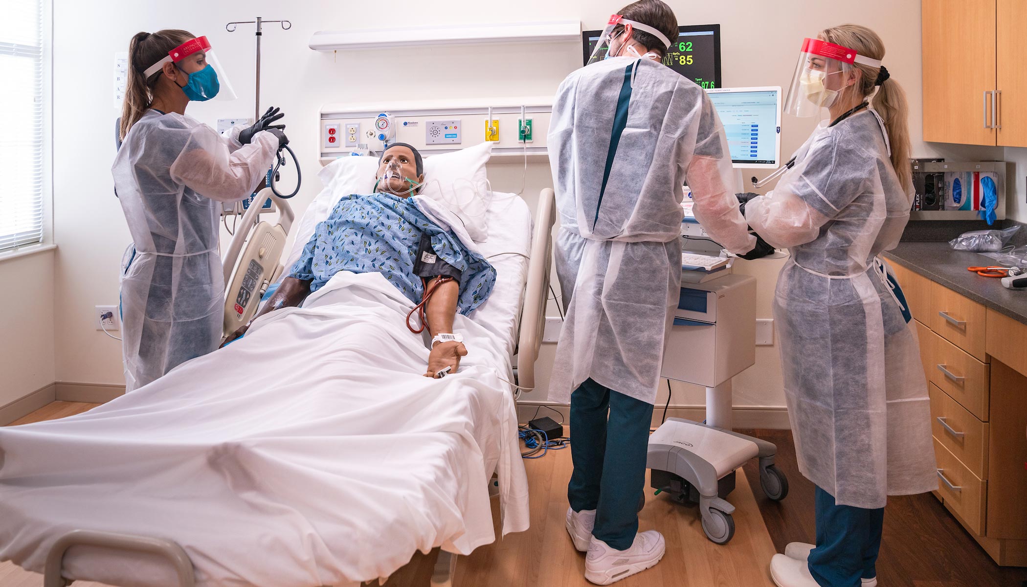 students working in the clinical simulation center