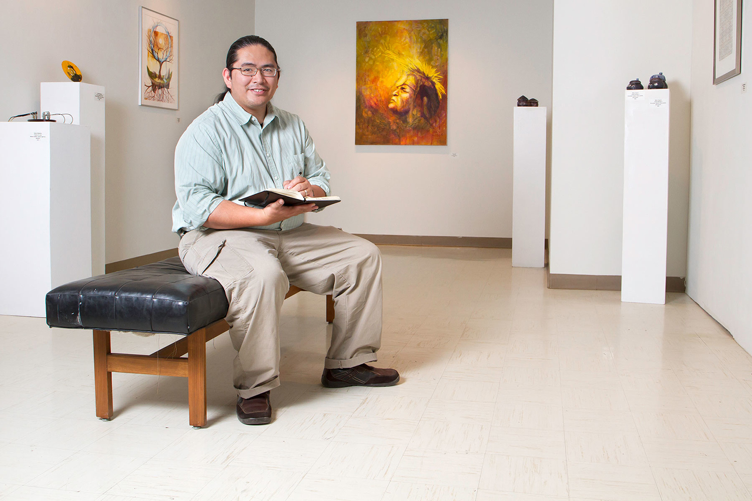 student sitting in an art gallery