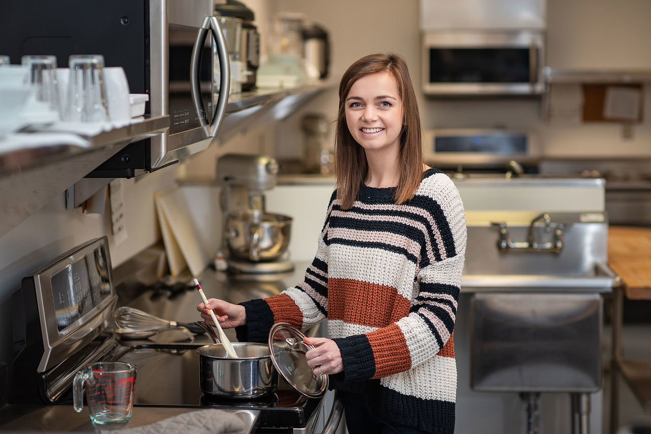 student in a kitchen