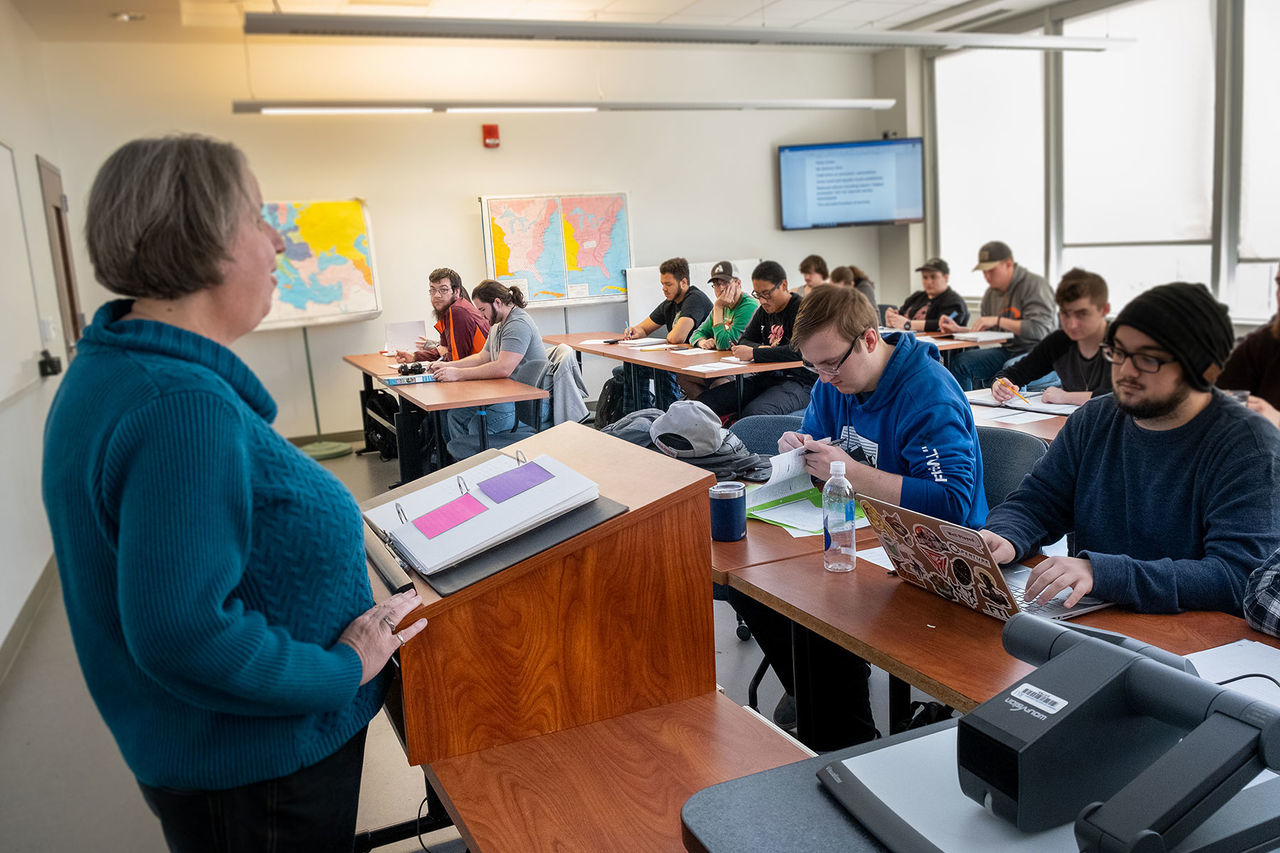 teacher presenting in front of a classroom