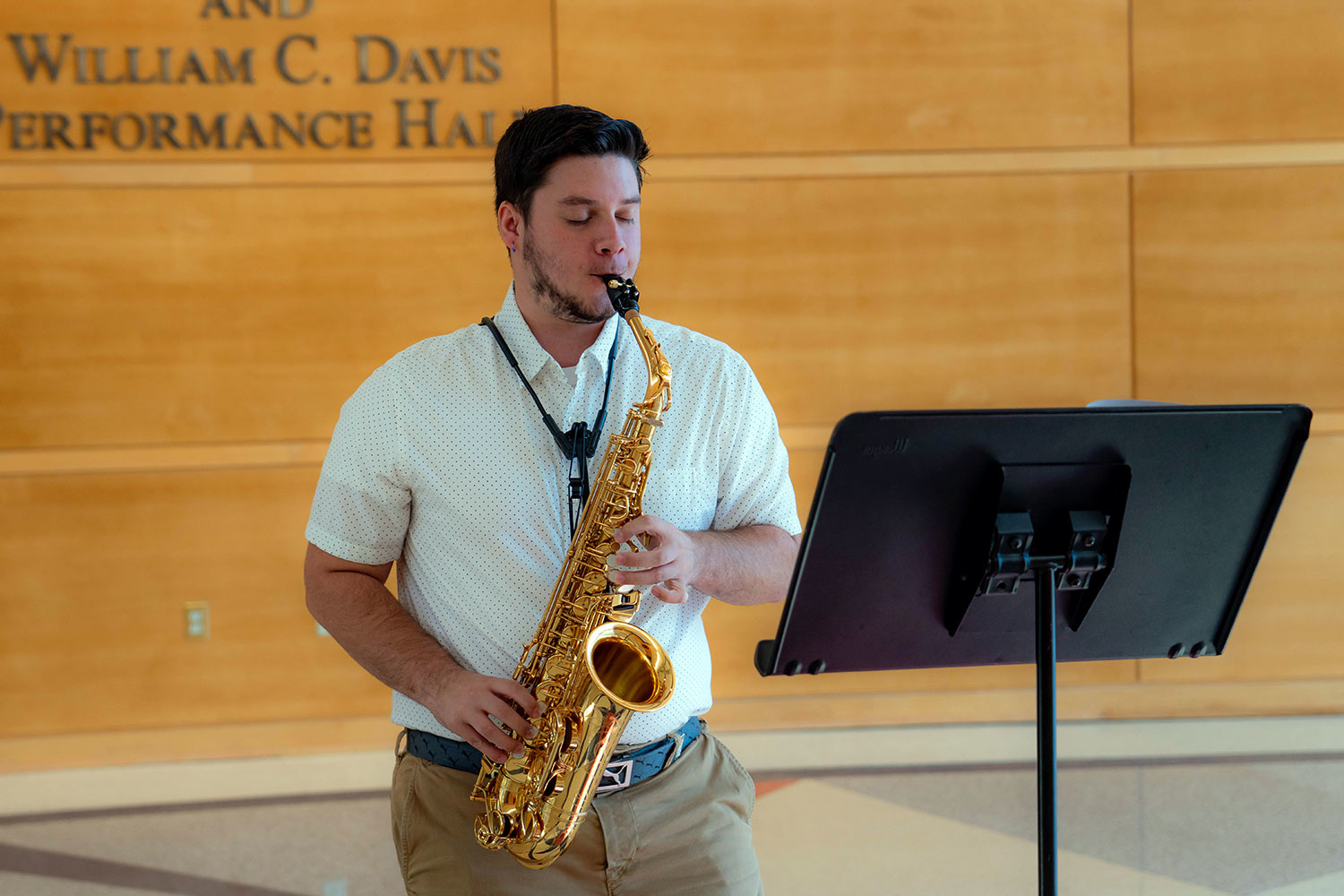 student playing the saxophone