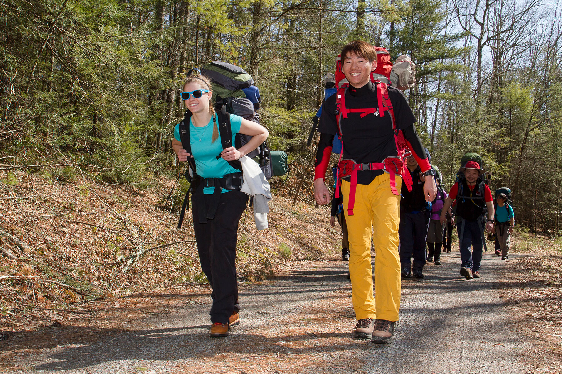 student back packing in woods