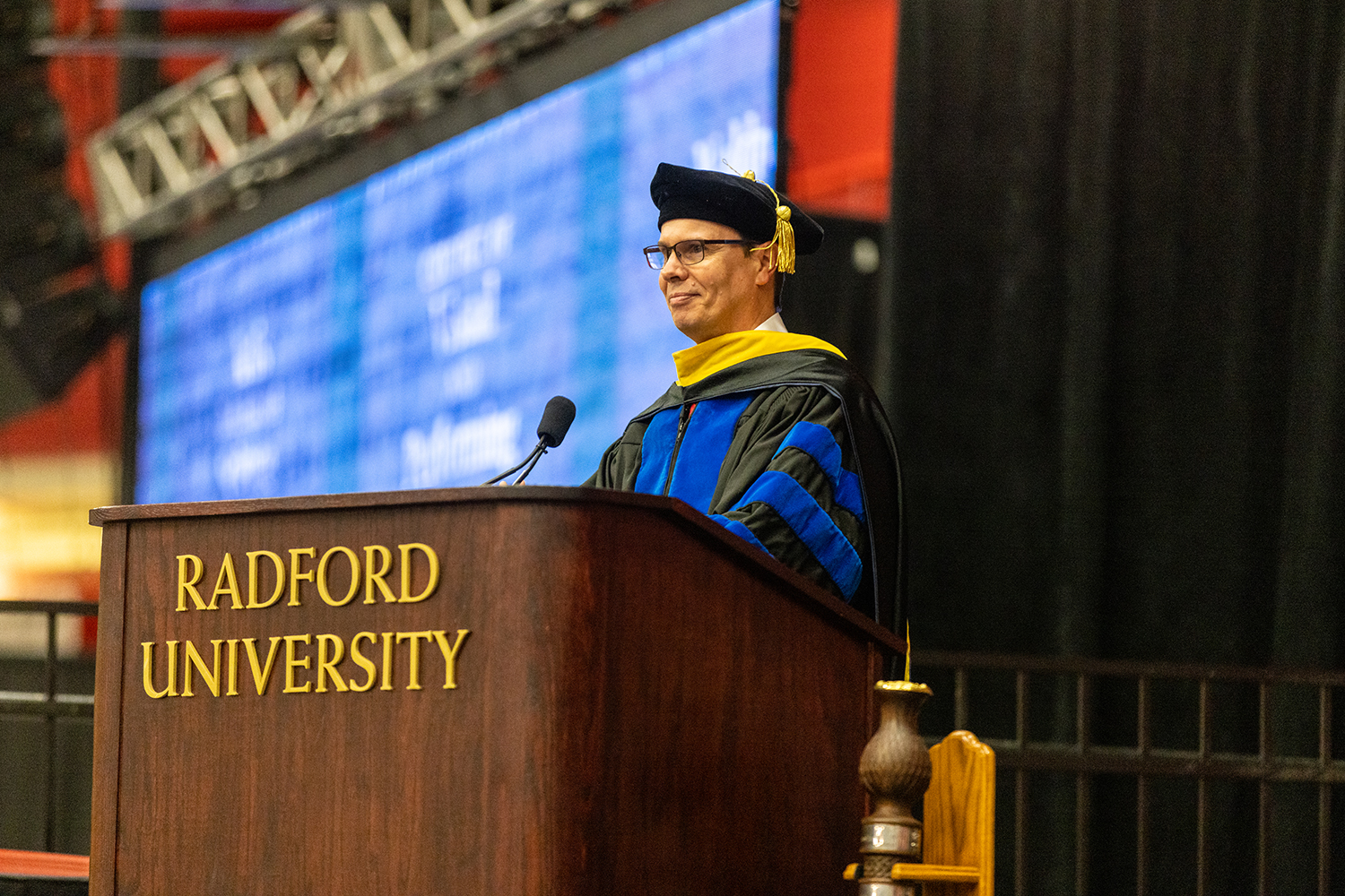 faculty member speaking at commencement